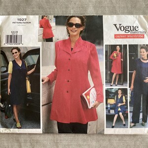 May include: Vogue maternity career wardrobe sewing pattern. The pattern features a red coat, a navy blue dress, and a navy blue jumpsuit. The pattern includes a variety of styles for maternity wear. The pattern number is 1927.