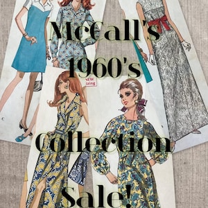 May include: A collection of four vintage McCall's sewing patterns from the 1960s featuring illustrations of various dress styles, including a blue shift dress, a floral shirt dress, a long paisley gown with a red sash, and a yellow floral dress.