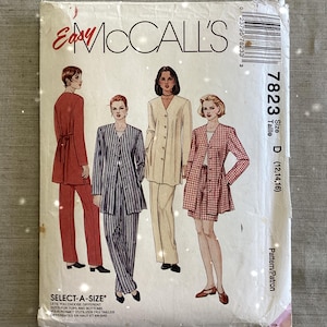 May include: Vintage McCall's sewing pattern envelope with illustrations of women's suits and separates. The envelope is labelled "Easy McCall's" and includes size details. The designs include a red trouser suit, a striped suit, and a skirt suit.