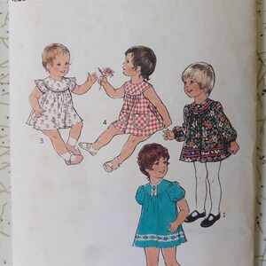 May include: Vintage sewing pattern for toddler dresses. The pattern features illustrations of four different dress styles. The text on the pattern reads "1106", "Size 1", and "Breast 20 inches".