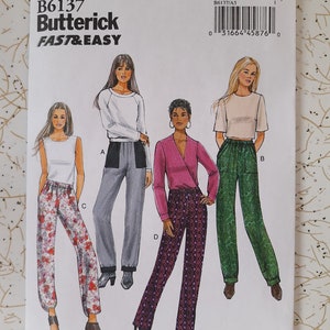 May include: A Butterick sewing pattern, B6137, showing illustrations of four different trouser styles. The pattern includes sizes A5 (6-8-10-12-14). The cover displays the Butterick logo and the words "FAST & EASY".