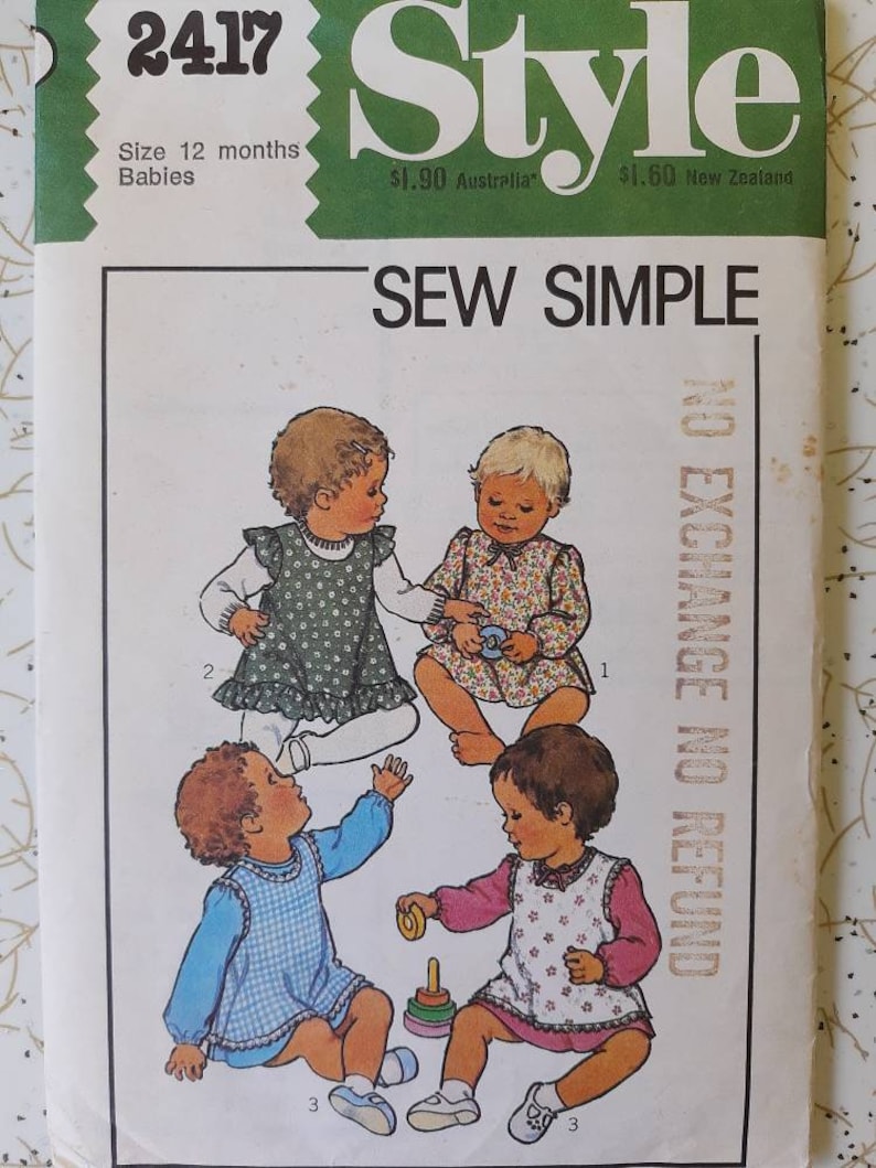 May include: Vintage sewing pattern titled "Style" for 12-month-old babies. The cover features illustrations of four babies in different outfits. The text "SEW SIMPLE" is prominently displayed. The pattern includes the text "NO EXCHANGE NO REFUND".