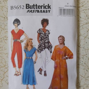 May include: A sewing pattern for three different dresses. The pattern is from Butterick and is labelled "Fast & Easy". The pattern number is B5652. The dresses are a red jumpsuit, a blue dress with a V-neck, and a long orange dress with a V-neck.