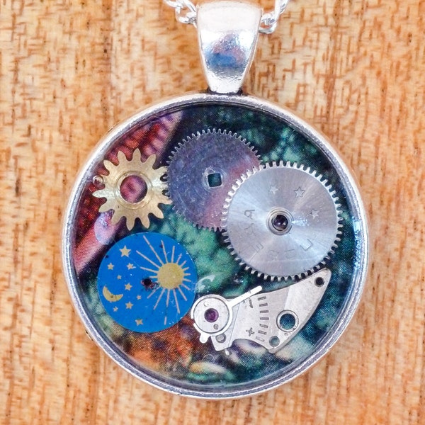 Vintage watch parts In resin set in an antique silver cabochon pendant hung on an 18" silver chain necklace