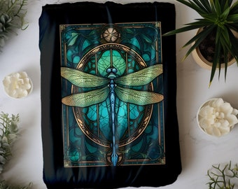 May include: A black throw pillow with a colorful dragonfly design. The dragonfly is surrounded by a stained glass-like frame with gold accents. The background is black.