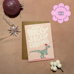 Cartão de Natal Raptor | Pastel Sonhador | Festivo | Vibrações Divertidas e Groovy | Download Digital | Imprimível | Rosa e Roxo | Imprimível | Dinossauro