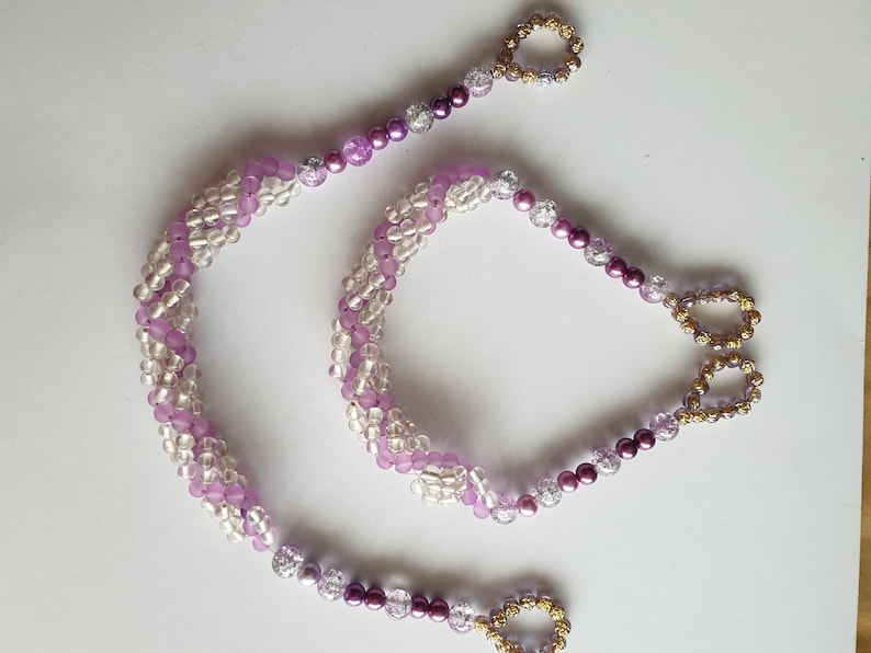 Purple and clear ornate curtain tie backs
