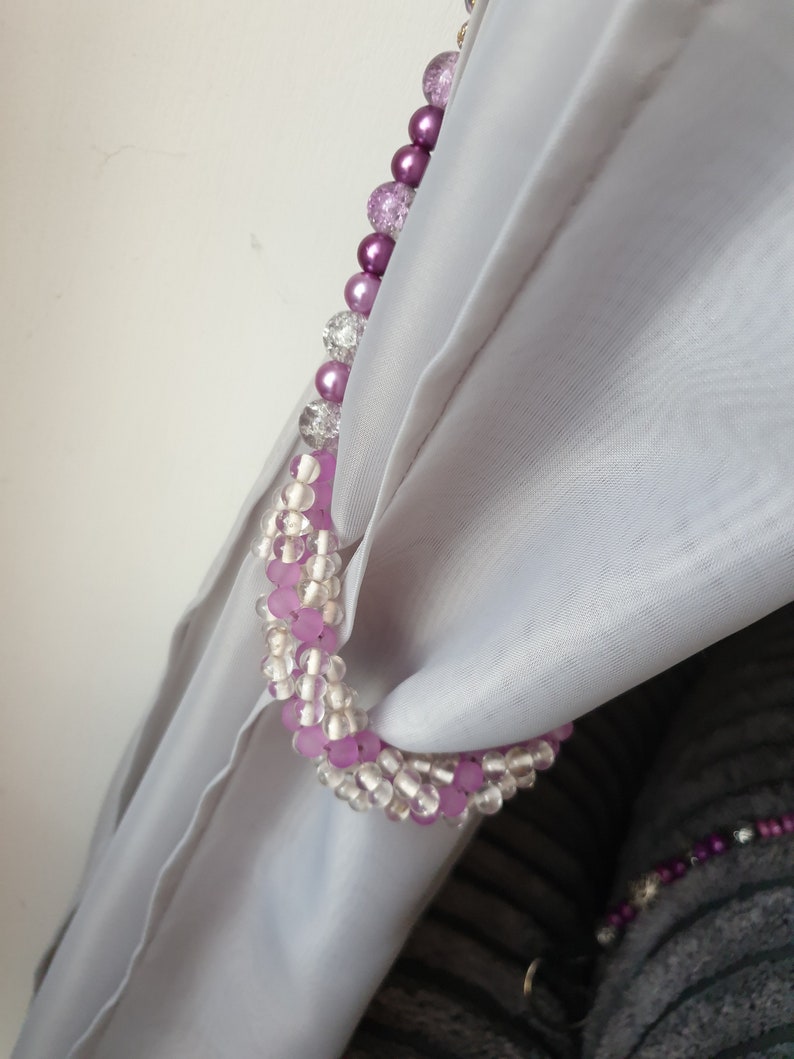 Purple and clear ornate curtain tie backs