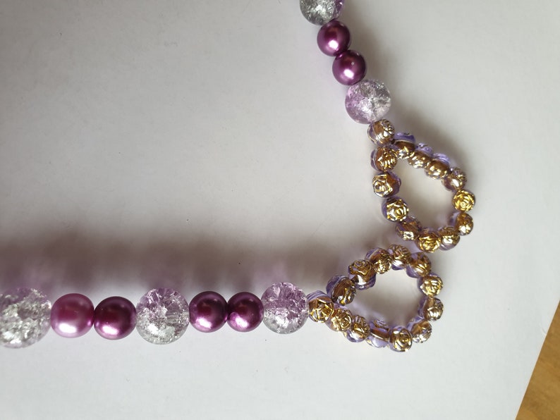 Purple and clear ornate curtain tie backs