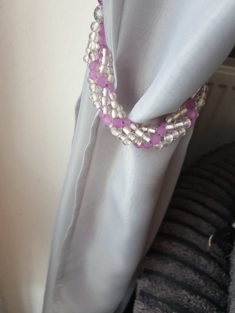 Purple and clear ornate curtain tie backs