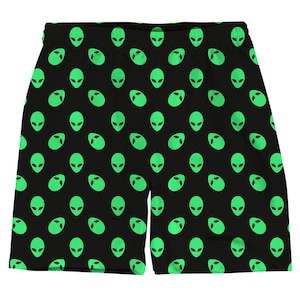 May include: Black athletic shorts with a green alien face pattern.