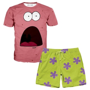 May include: A pink t-shirt with a cartoon face of Patrick Star from Spongebob Squarepants. The shirt has a surprised expression with a wide open mouth. The t-shirt is paired with green shorts with purple starfish patterns.