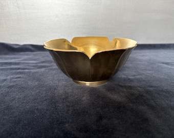 Golden decorative bowl in form of a lotus flower