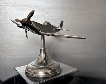 Vintage aluminium model of Spitfire aircraft