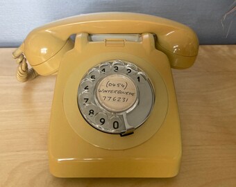 Vintage yellow rotary telephone, Retro GPO mustard phone