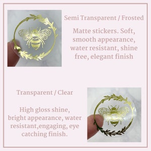 May include: Two clear sticker options with a gold bee design. The top sticker is semi-transparent with a matte finish. The bottom sticker is transparent with a high gloss finish. Both stickers are water resistant.