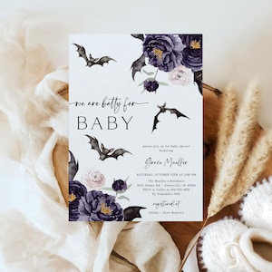 May include: A baby shower invitation with a Halloween theme. The invitation features watercolor illustrations of bats and dark purple flowers. The text reads "we are batty for BABY" and includes event details such as the date, time, and location.