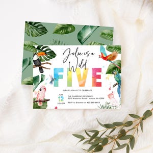 May include: A colorful invitation for a child's 5th birthday party. The invitation features a rainbow-colored "FIVE" with tropical birds and leaves. The text reads "Jolie is a Wild FIVE" and includes the date, time, and location of the party.