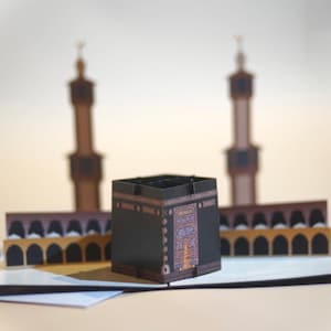Tarjeta emergente 3D Kaba: abraza la belleza del Hajj y la Umrah