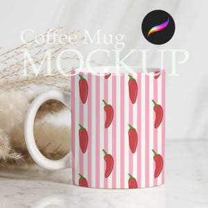May include: White ceramic coffee mug with a repeating pattern of red chili peppers on a pink and white striped background. The mug has a white handle and the text "Coffee Mug MOCKUP" is visible.