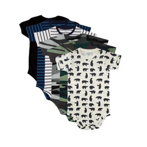 May include: A stack of five baby onesies. The onesies are in various colors and patterns, including black, white, blue, and camouflage. One onesie has a pattern of black bears.
