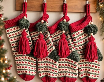 May include: Four matching Christmas stockings made of knit fabric in red, cream, and dark green with a geometric pattern. Each stocking features a red knit cuff, a dark green pom-pom, a wooden bead, and a large red yarn tassel hanging from the top.