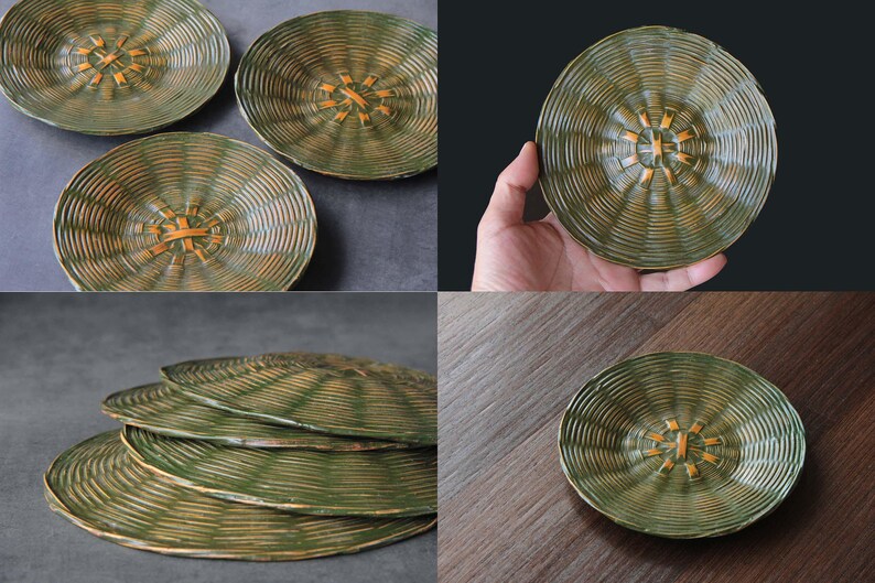 May include: Set of four green and gold ceramic plates with a woven center design. The plates have a ridged texture and a circular shape. The plates are displayed on a dark surface and a wooden surface.