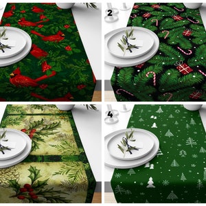 May include: Four different Christmas table runners with various designs. The first runner features red cardinals and green foliage on a dark green background. The second runner has a green and black design with candy canes and presents. The third runner has a vintage look with holly and berries on a cream background. The fourth runner has a simple design with white Christmas trees on a dark green background.