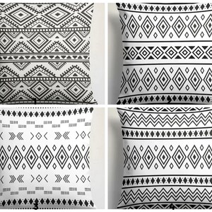May include: Four black and white throw pillow covers with geometric patterns. The patterns include diamonds, zigzags, and lines.