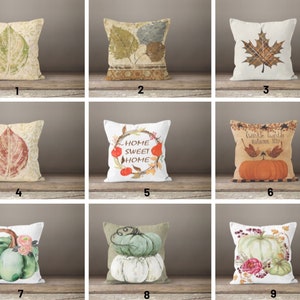 May include: Nine different throw pillow designs featuring autumn themes. The pillows feature images of leaves, pumpkins, and the text "Home Sweet Home".
