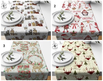 May include: Four different Christmas table runners with various designs. The first runner features a white background with red and yellow houses. The second runner has a white background with red and white Christmas characters. The third runner has a green background with red berries, green trees, and brown reindeer. The fourth runner has a cream background with green trees, red reindeer, and the words "Merry Christmas".