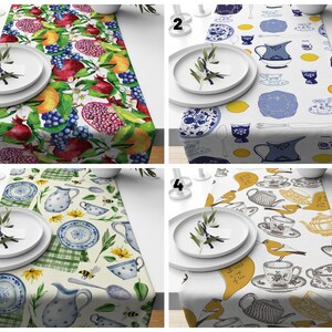 May include: Four different table runner designs. The first runner features a watercolor pattern of pomegranates, grapes, lemons, and leaves. The second runner features a blue and white pattern of teacups, teapots, and lemons. The third runner features a yellow and blue pattern of teacups, teapots, bees, and sunflowers. The fourth runner features a yellow and gray pattern of teacups, teapots, birds, and the text "I need a cup of tea".