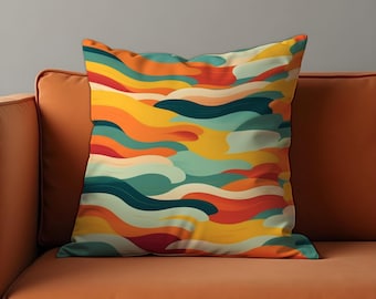 May include: A colorful throw pillow with a wavy abstract pattern in shades of orange, yellow, green, and blue. The pillow is on a brown couch.