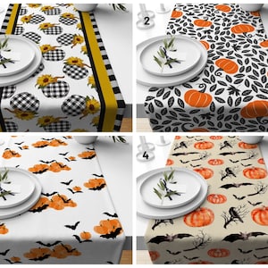 May include: Four different table runners with various Halloween themes. The first runner features black and white checked pumpkins with sunflowers. The second runner has black leaves and orange pumpkins. The third runner has orange pumpkins and black bats. The fourth runner has orange pumpkins, black crows, and branches.