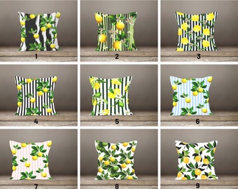 May include: Nine different pillow designs featuring lemons and stripes. The pillows are all white with various colored stripes and lemon designs.