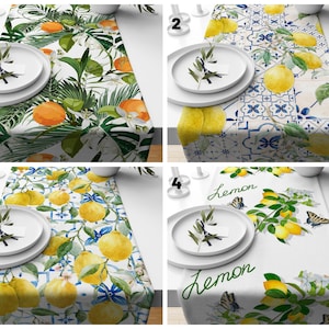 May include: Four different table runner designs featuring lemons and citrus fruits. The designs include a white background with green leaves and lemons, a white background with blue and white tiles and lemons, a white background with green leaves and lemons, and a white background with green leaves and lemons with the word "lemon" written on the runner.