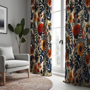May include: A pair of cream-colored curtains with a bold floral pattern in shades of blue, orange, and yellow. The curtains feature a repeating design of large flowers, leaves, and stems.
