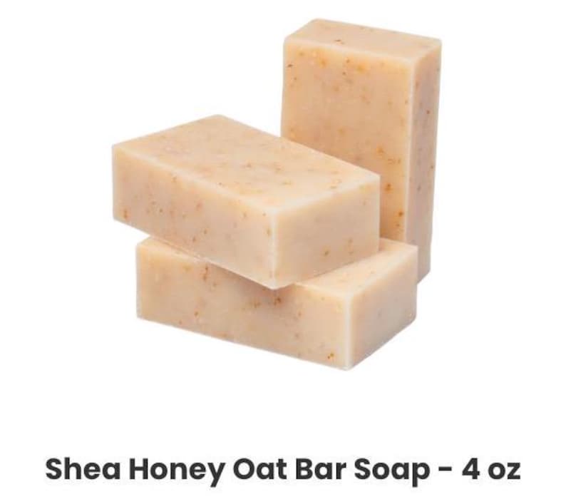 May include: Three bars of Shea Honey Oat Bar Soap, each bar is 4 oz. The bars are stacked on top of each other, with the top bar being the largest.
