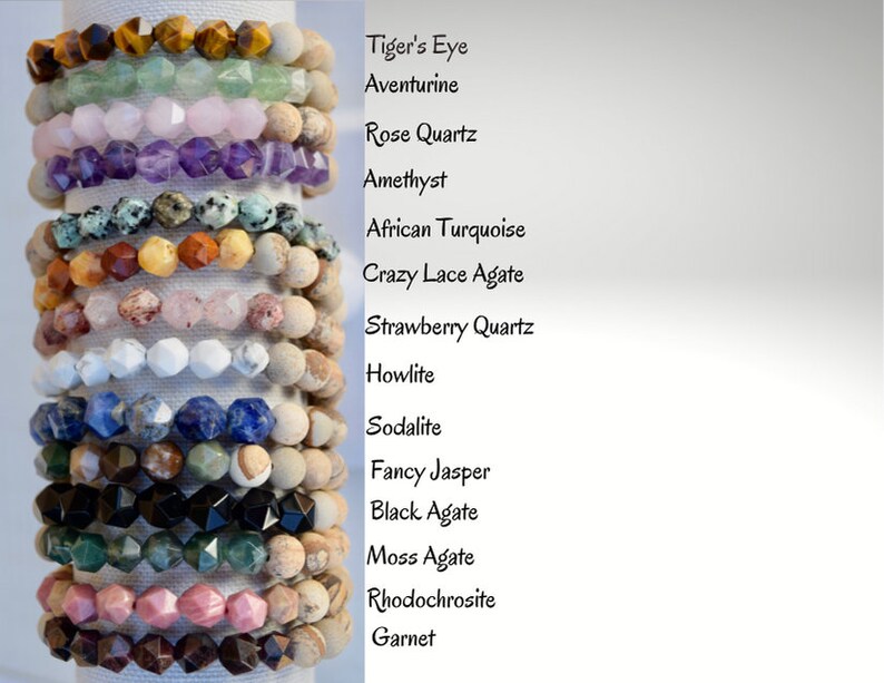 May include: A stack of 14 bracelets made with different types of gemstones, including Tiger's Eye, Aventurine, Rose Quartz, Amethyst, African Turquoise, Crazy Lace Agate, Strawberry Quartz, Howlite, Sodalite, Fancy Jasper, Black Agate, Moss Agate, Rhodochrosite, and Garnet.