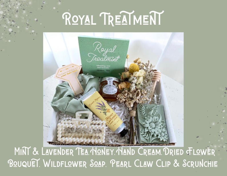 May include: A gift box labeled "Royal Treatment" containing a variety of self-care items. Includes a green box of tea, honey, hand cream, a dried flower bouquet, wildflower soap, a pearl claw clip, and a scrunchie. The box is presented on a light green background.