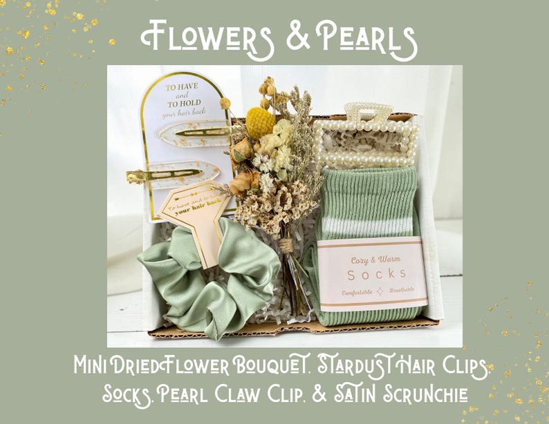 May include: A gift box with a mini dried flower bouquet, stardust hair clips, socks, a pearl claw clip, and a satin scrunchie. The box includes a pair of green socks with white stripes and a light green satin scrunchie.
