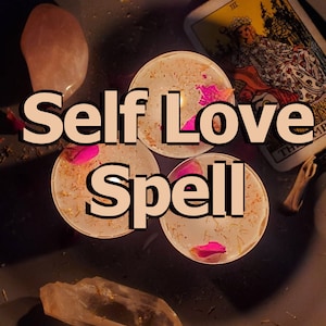 May include: Three lit candles with pink rose petals and dried herbs, with the text "Self Love Spell". A rose quartz crystal and a tarot card are also visible. The candles are on a dark surface.