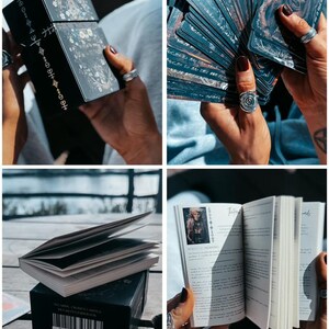 May include: A black tarot card box and deck with detailed illustrations. The box has gold accents and text. The cards are fanned out, revealing detailed artwork. A small book with illustrations and text is also visible.