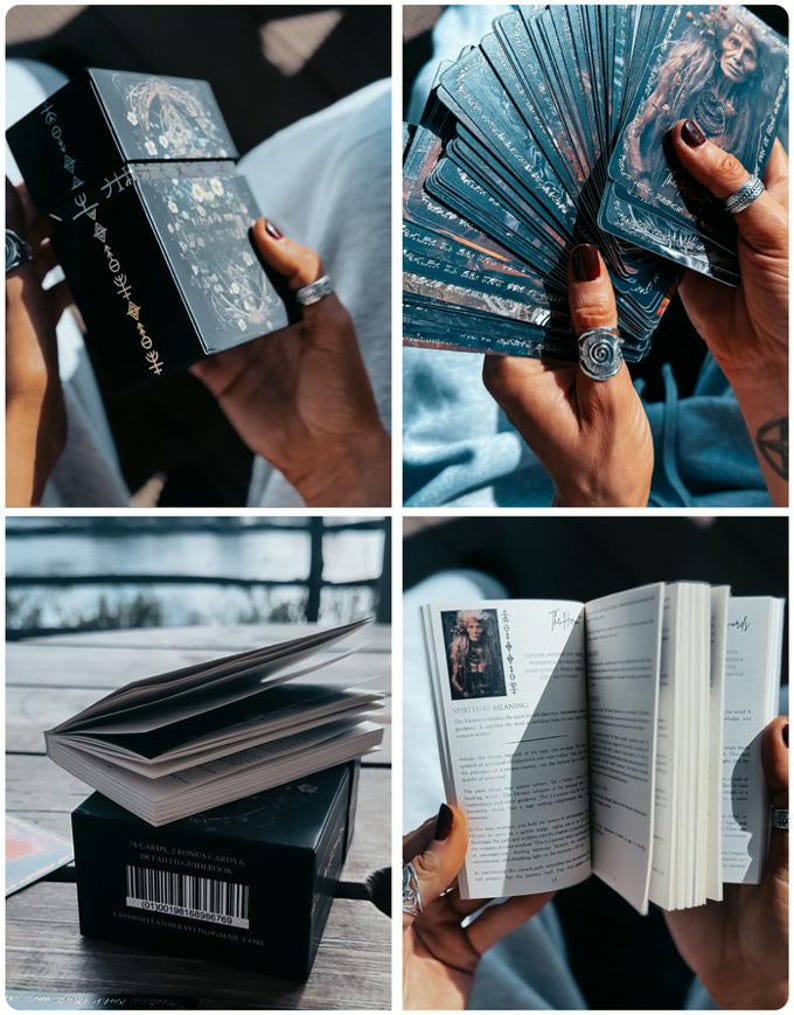May include: A black tarot card box and deck with detailed illustrations. The box has gold accents and text. The cards are fanned out, revealing detailed artwork. A small book with illustrations and text is also visible.