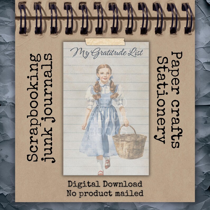Oz themed My Gratitude List printable page displayed in scrapbook journal setting. Vintage Dorothy illustration over lined paper background. Printable stationery insert for junk journals, planner pages, gratitude journaling, and traveler’s notebooks. Digital download paper craft supply.