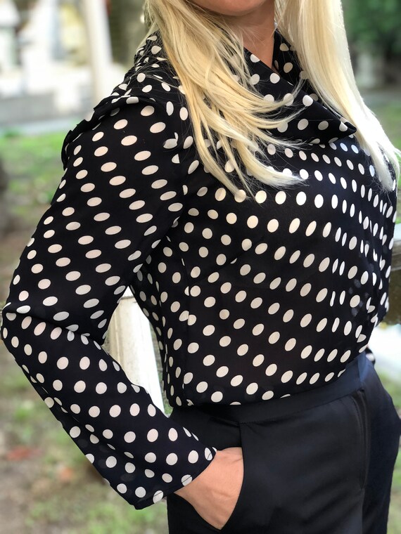 navy blue blouse with white polka dots