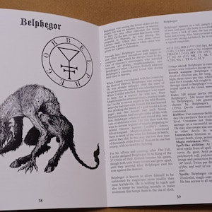 May include: A black and white illustration of a demon with horns and claws. The demon is crouched and has a menacing expression. The text "Belphegor" is at the top of the page. The text "38" is at the bottom of the page.
