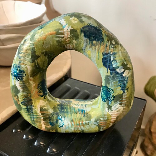 Rolling shops wheel, ceramic sculpture