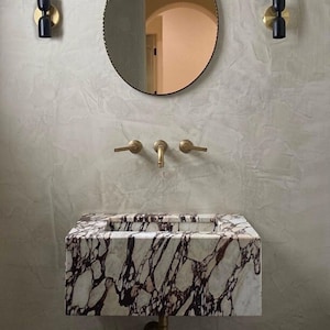 Calacatta Viola Fully Integrated wall mounted sink in Italian marble. Customizable on your bath dimensions.
