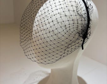 Minette: a birdcage veil set on a thin satin covered headband. Available in different colours.
